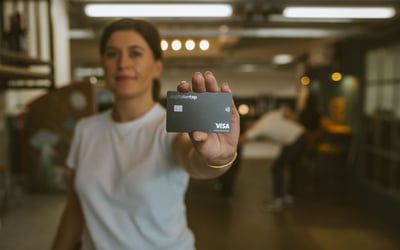 Woman Holding Capital On Tap Business Credit Card