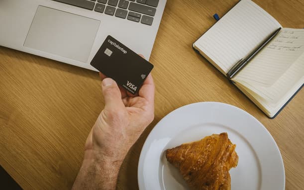 Holding Capital On Tap Business Credit Card On Table