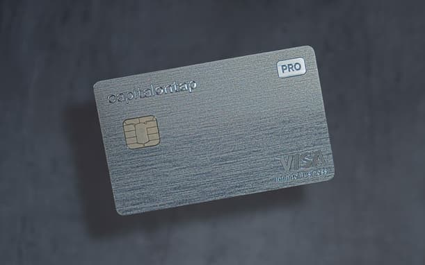 Capital On Tap Pro Metal Visa Infinite Business Card On A Dark Textured Background