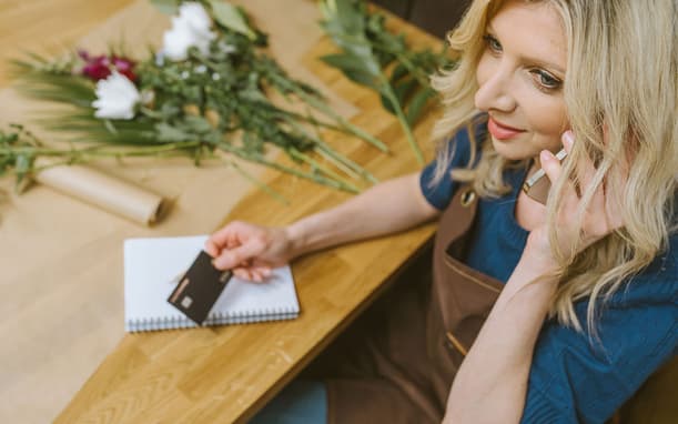 Florist On The Phone With Capital On Tap Business Credit Card