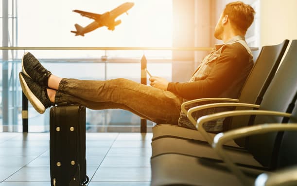 Man Sitting At The Airport