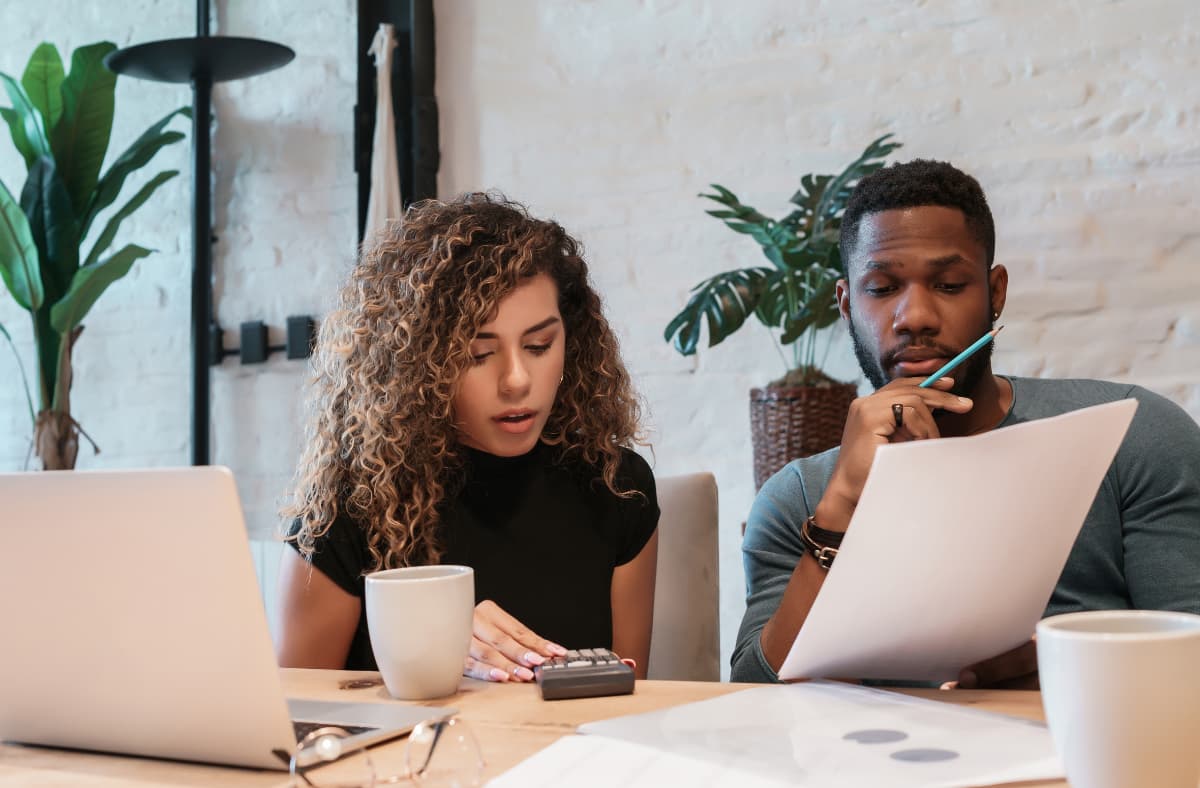 Two Employees Planning The Budget