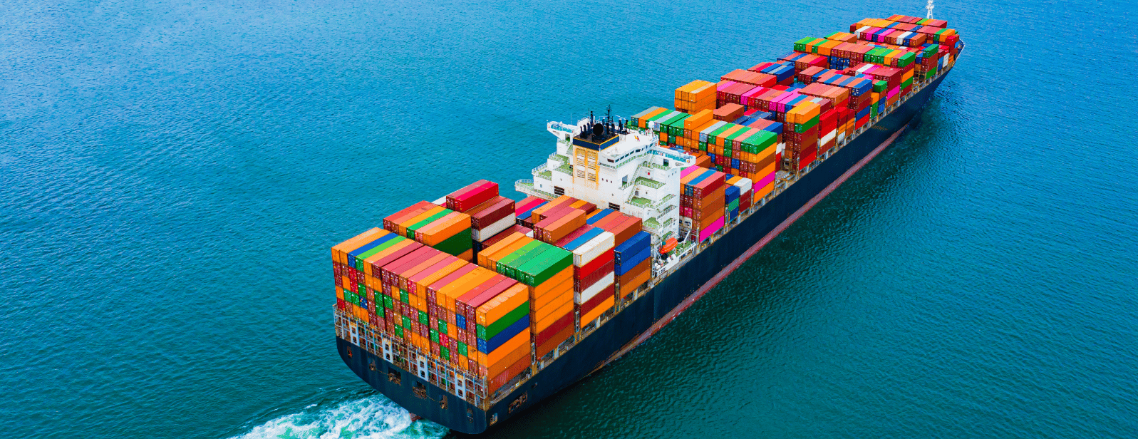 A cargo ship in the ocean carrying shipping containers