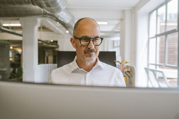 Man Looking At Laptop