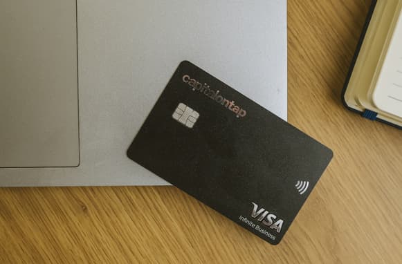 Capital On Tap Card On Edge Of Laptop