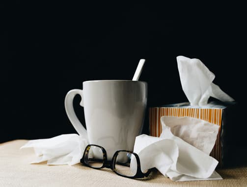 Tea Cup, Glasses And Tissues On Table