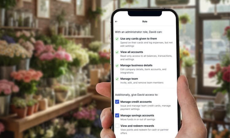 A Hand Holding A Phone Showing The Enhanced Team Management Feature On The Capital On Tap App