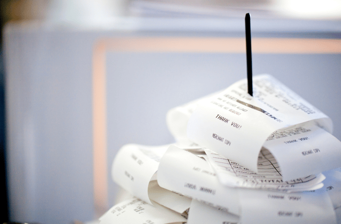 Receipts Stacked Up On A Stick