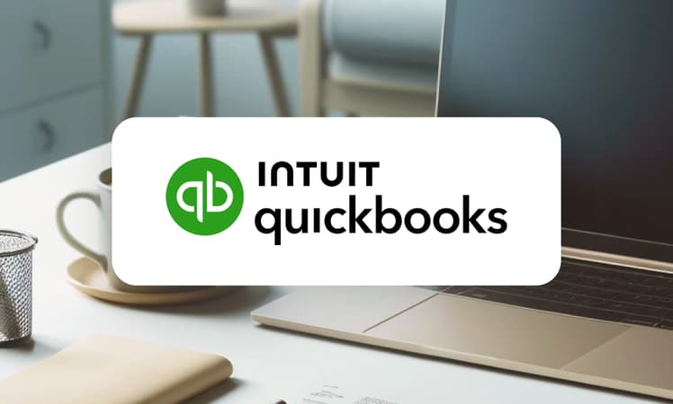 Quickbooks Logo In Front Of A Laptop