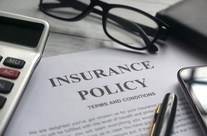 Focus Of Glasses On Insurance Policy Document