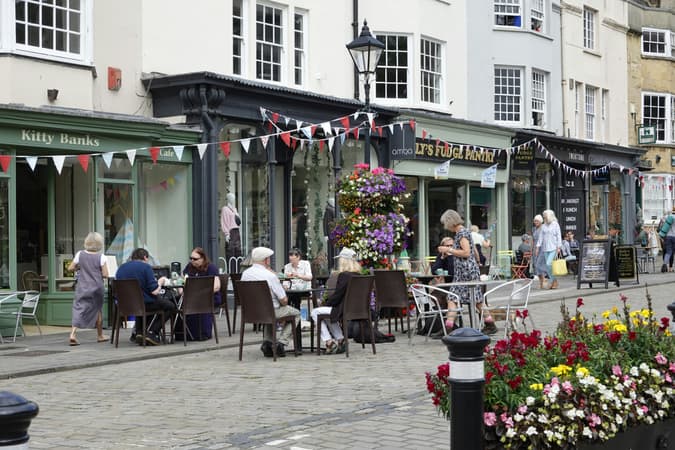 A Street Lined With Cafes And Shops