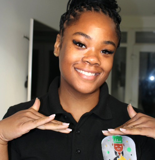 Monet Davis founder of Faceflavour, smiling into the camera