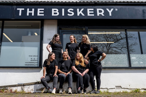 The Biskery team standing in front of their shop